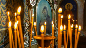 Orthodox Christian Worship Candles in Front of Icon